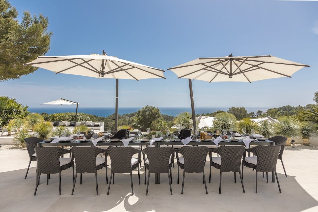 Alfresco dining twin parasols sea casa incendio ibiza spain padel