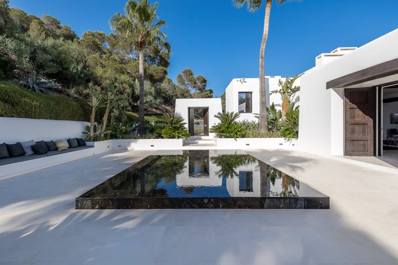 Courtyard reflecting pool seating casa incendio ibiza spain padel