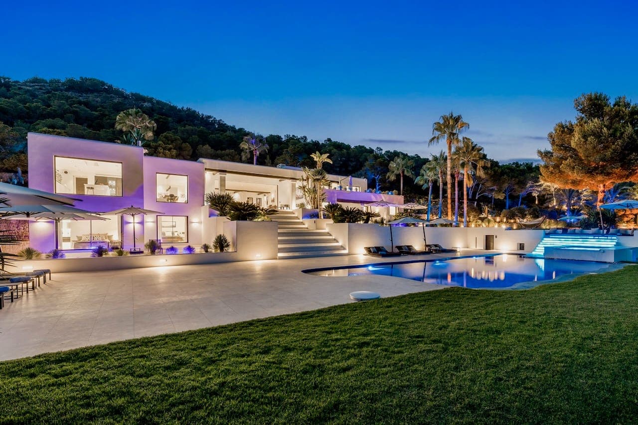 Dusk facade pool lawn casa incendio ibiza spain padel