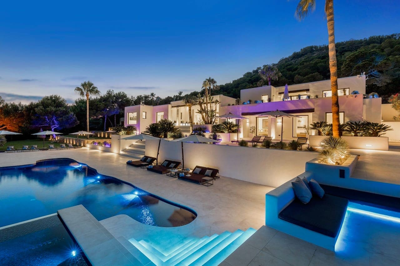 Dusk facade pool lit spa casa incendio ibiza spain padel