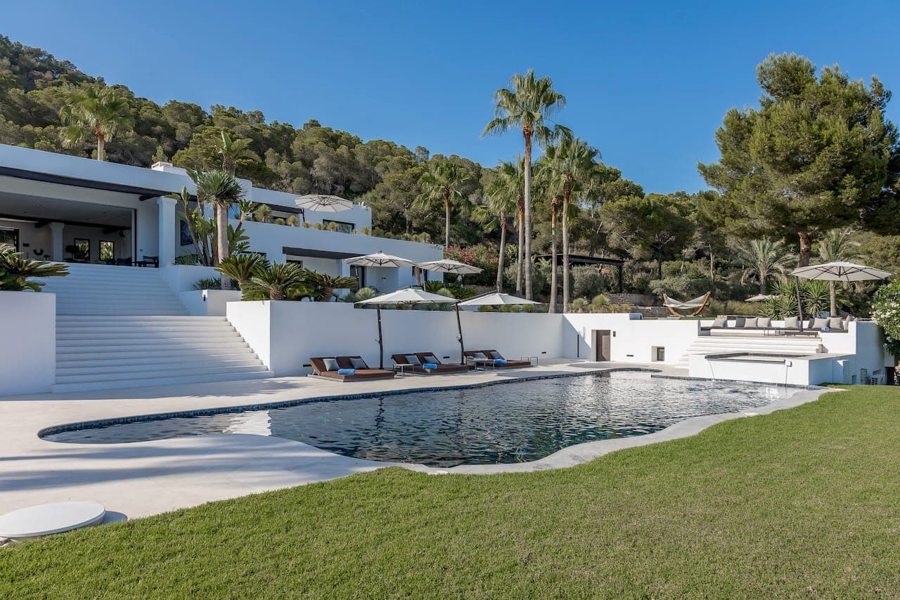 Facade pool loungers palms casa incendio ibiza spain padel