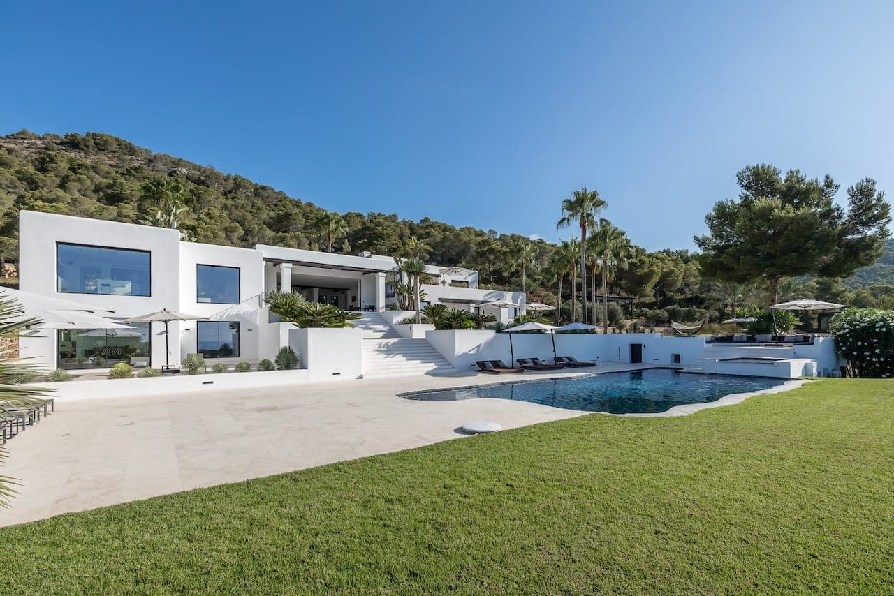 Hillside whitewashed facade pool casa incendio ibiza spain padel