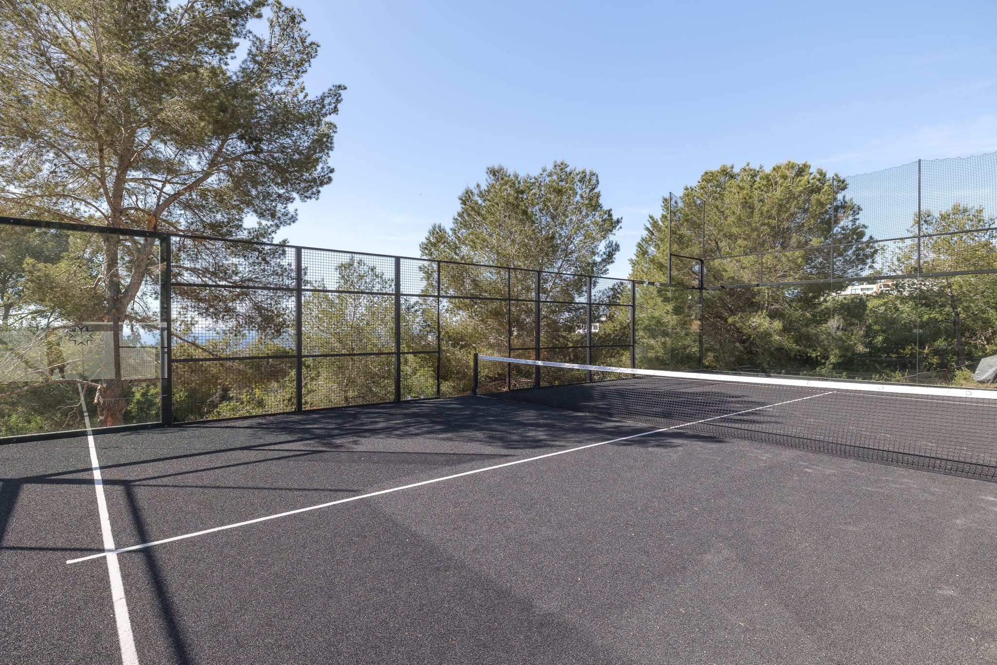 Inside the court, the glass at the back and the terraces above it