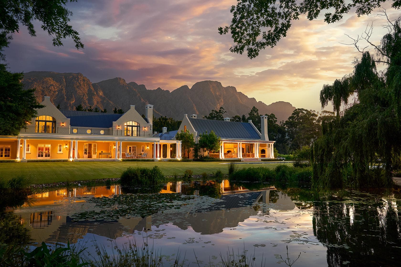 Manor house dusk pond reflection paddakloof franschhoek south africa padel