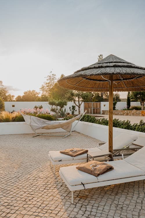 Loungers thatched parasol terrace quinta cipreste algarve portugal padel 2