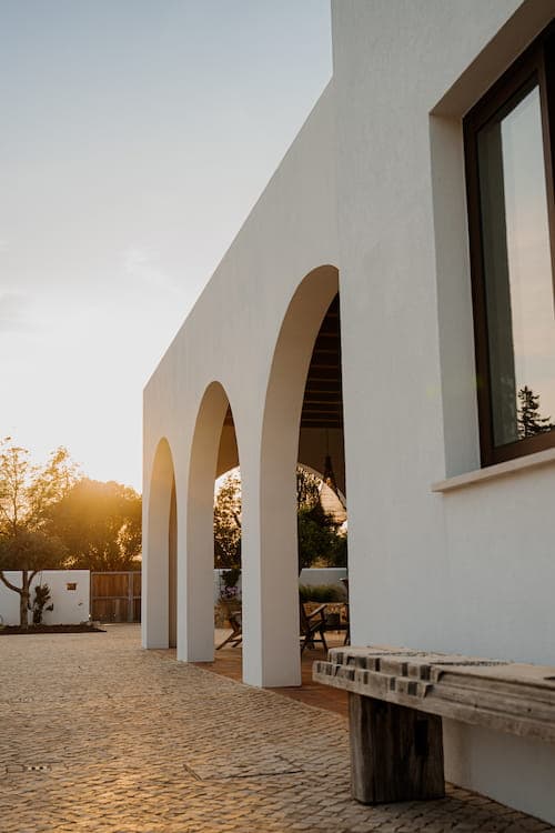 Whitewashed arched facade sunset quinta cipreste algarve portugal padel 2