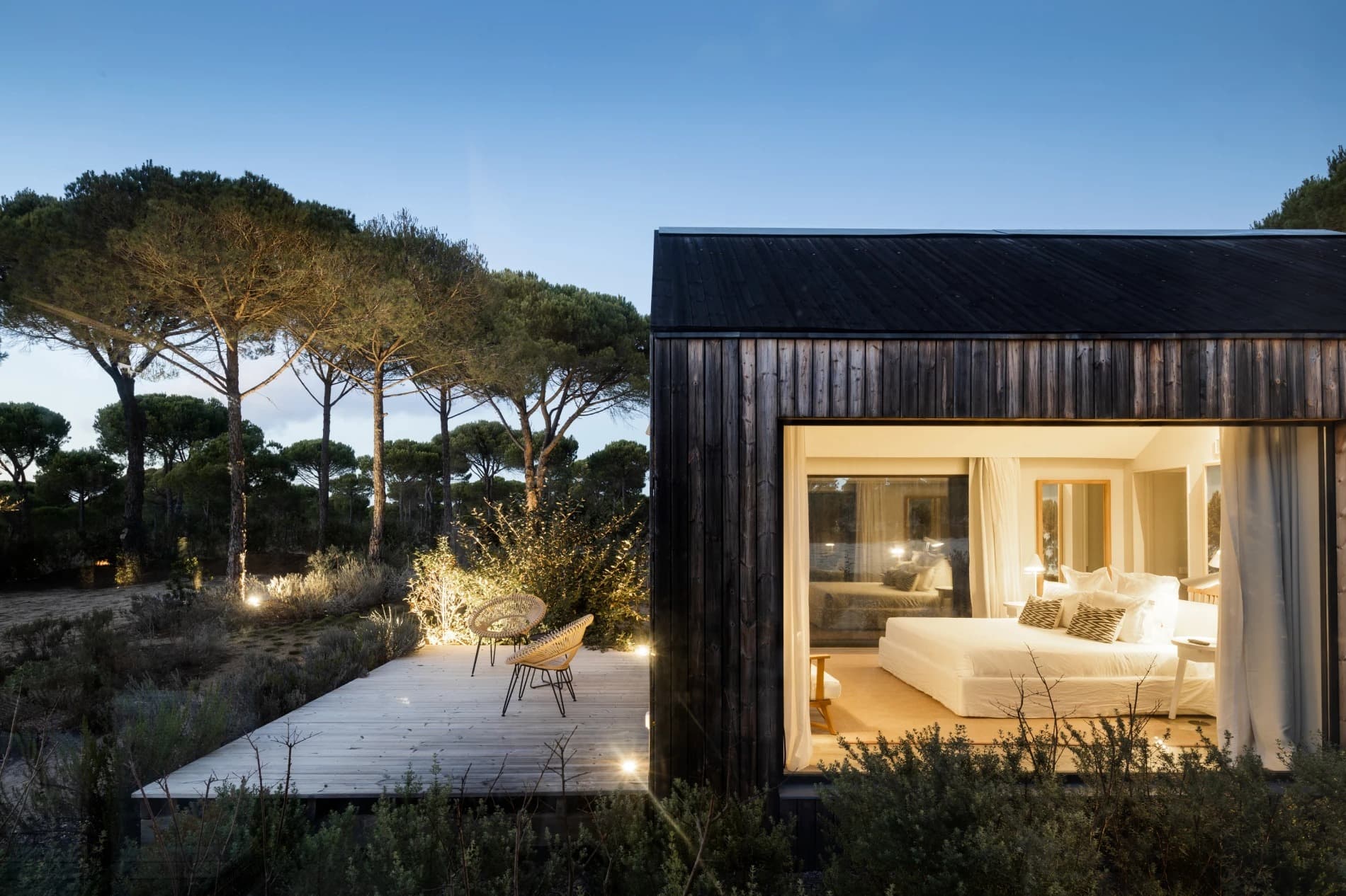Black timber cabin terrace dusk sublime comporta portugal padel