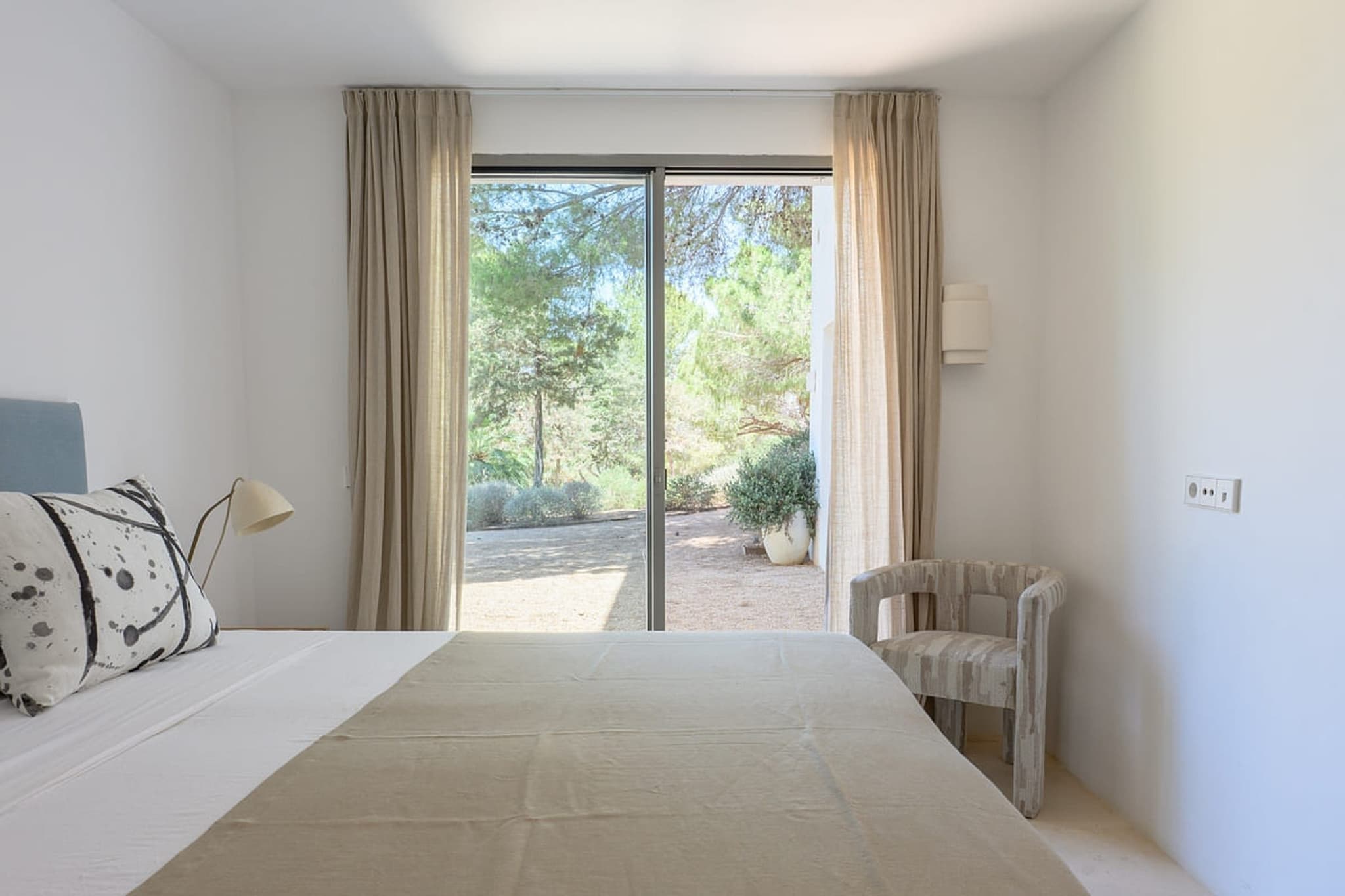 Bedroom garden view armchair villa cami ibiza spain padel