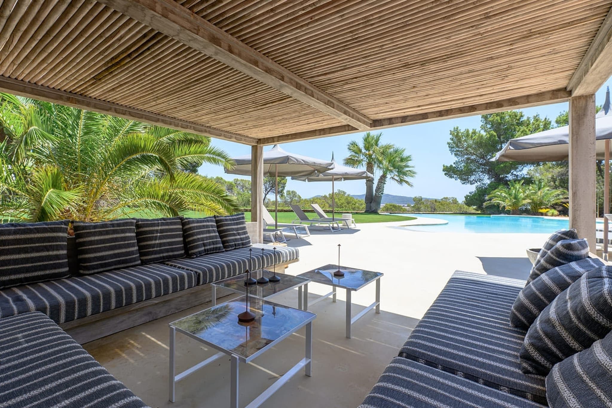 The covered lounge beside the pool