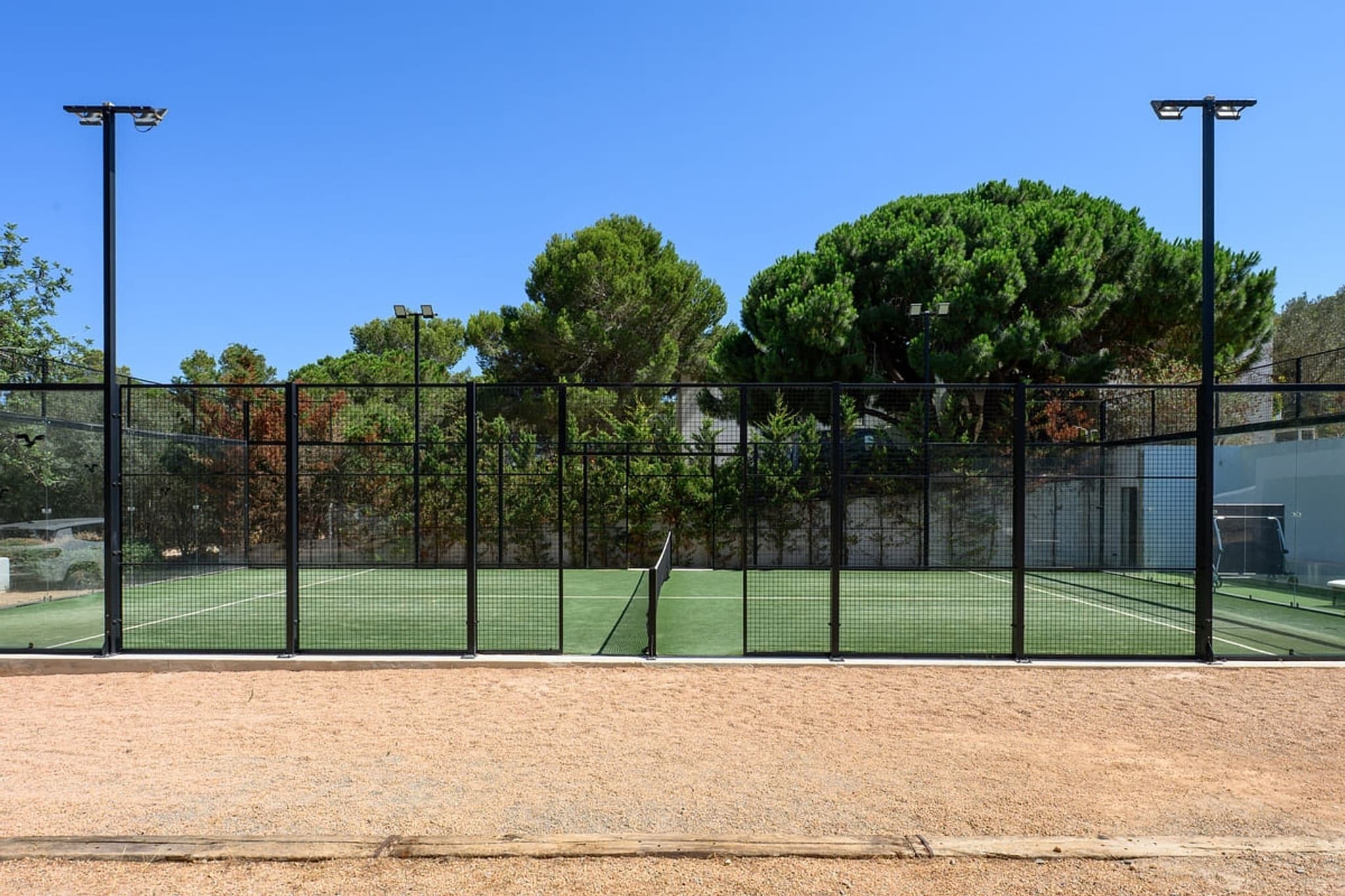 Private padel court fenced exterior villa cami ibiza spain