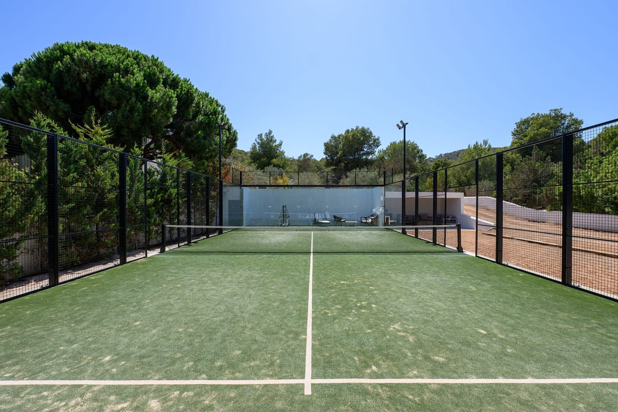 Private padel court green turf villa cami ibiza spain