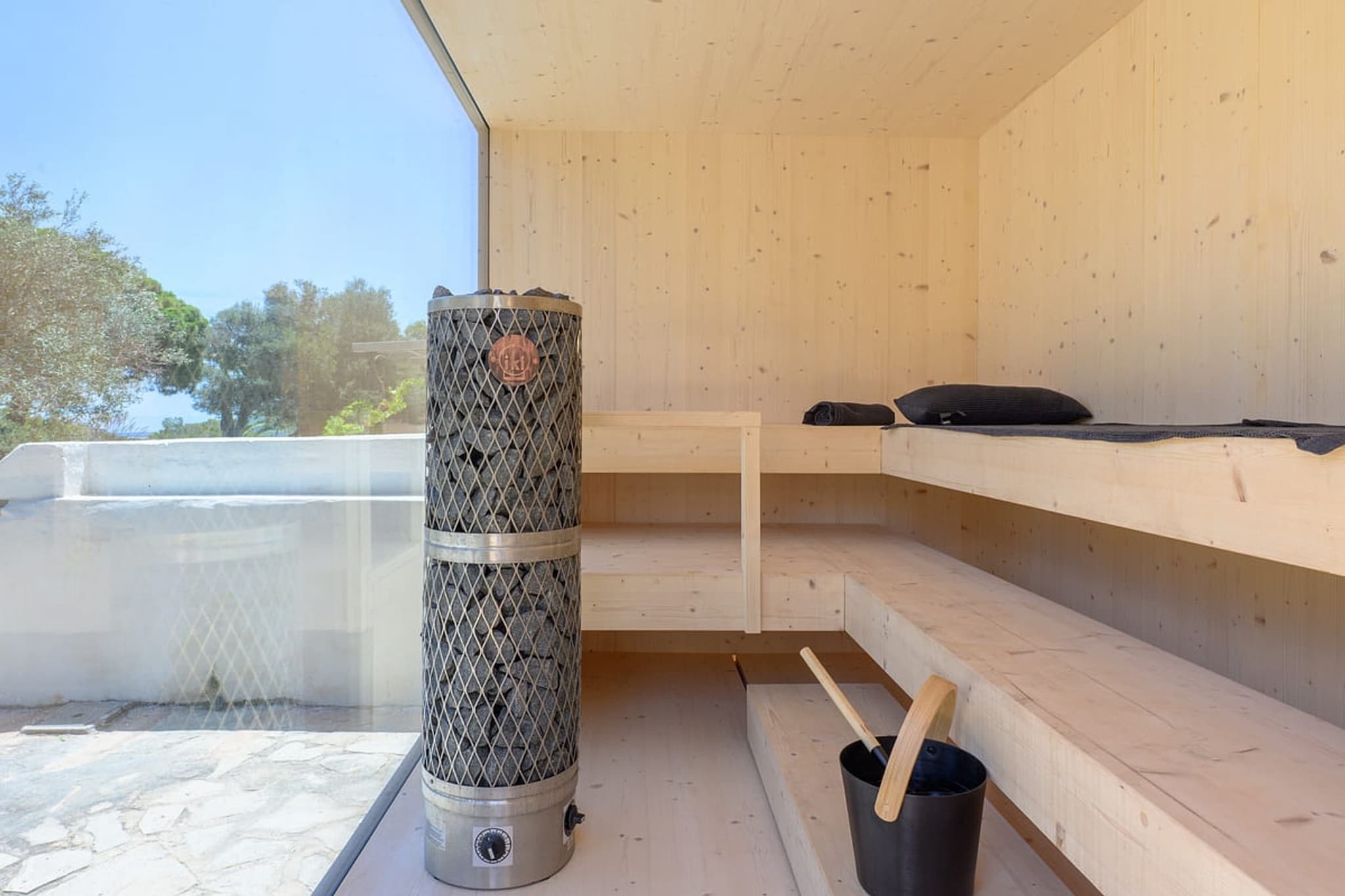 Inside the sauna, the heater in the corner