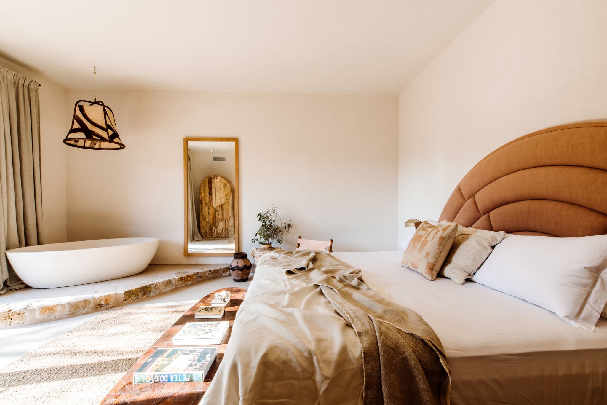 Bedroom freestanding bathtub arched headboard villa clarence ibiza spain padel