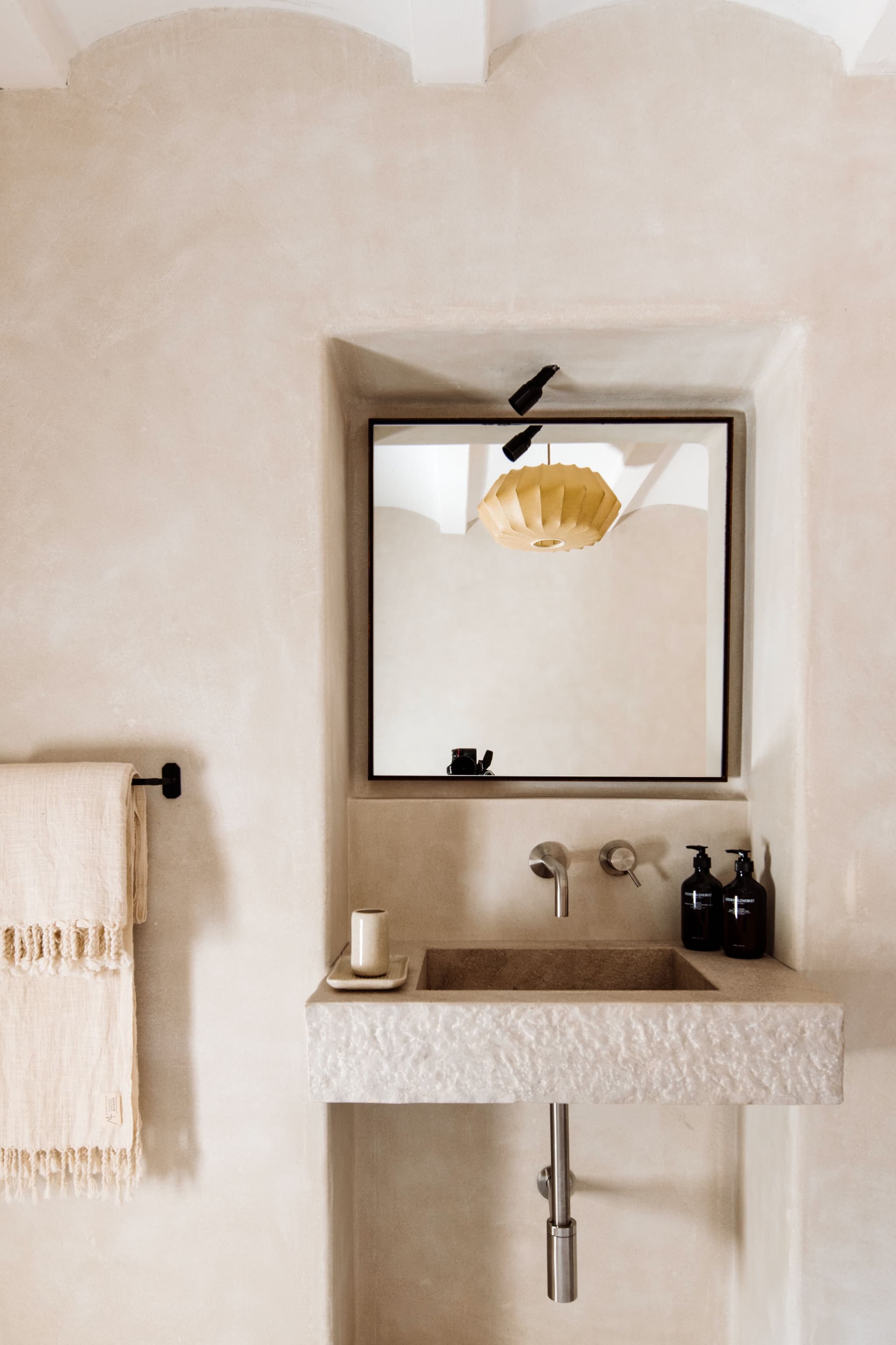 Carved stone basin mirror niche villa clarence ibiza spain padel