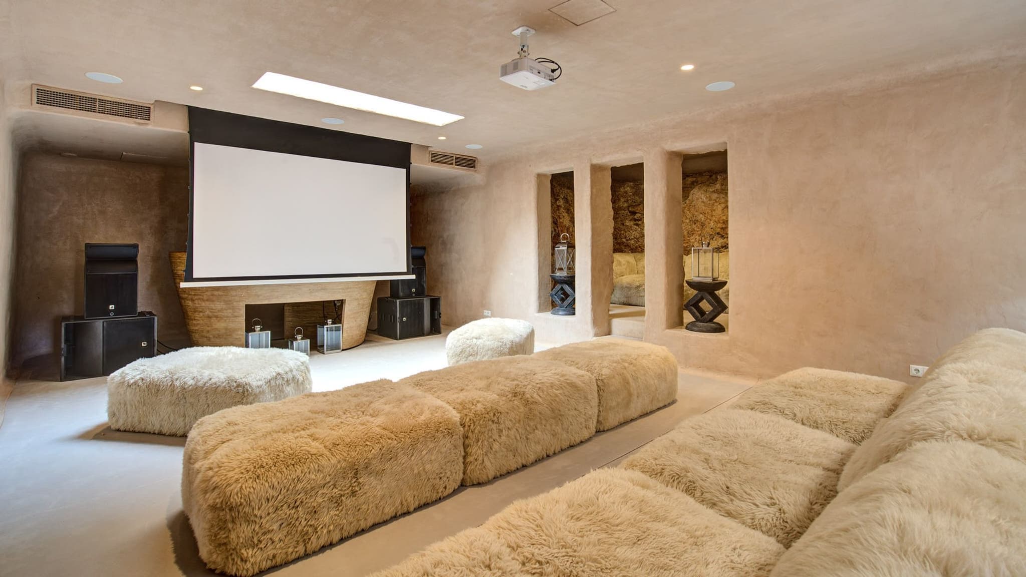 The cinema lounge, sheepskin sofas under a skylight