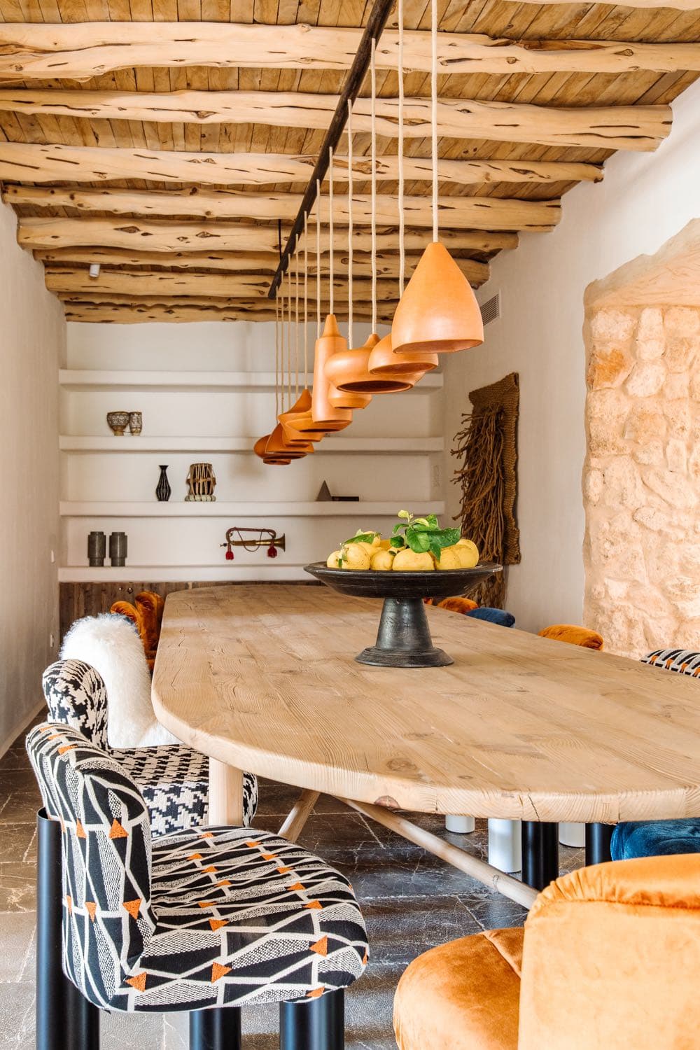 Oval dining table copper pendant cluster villa clarence ibiza spain padel