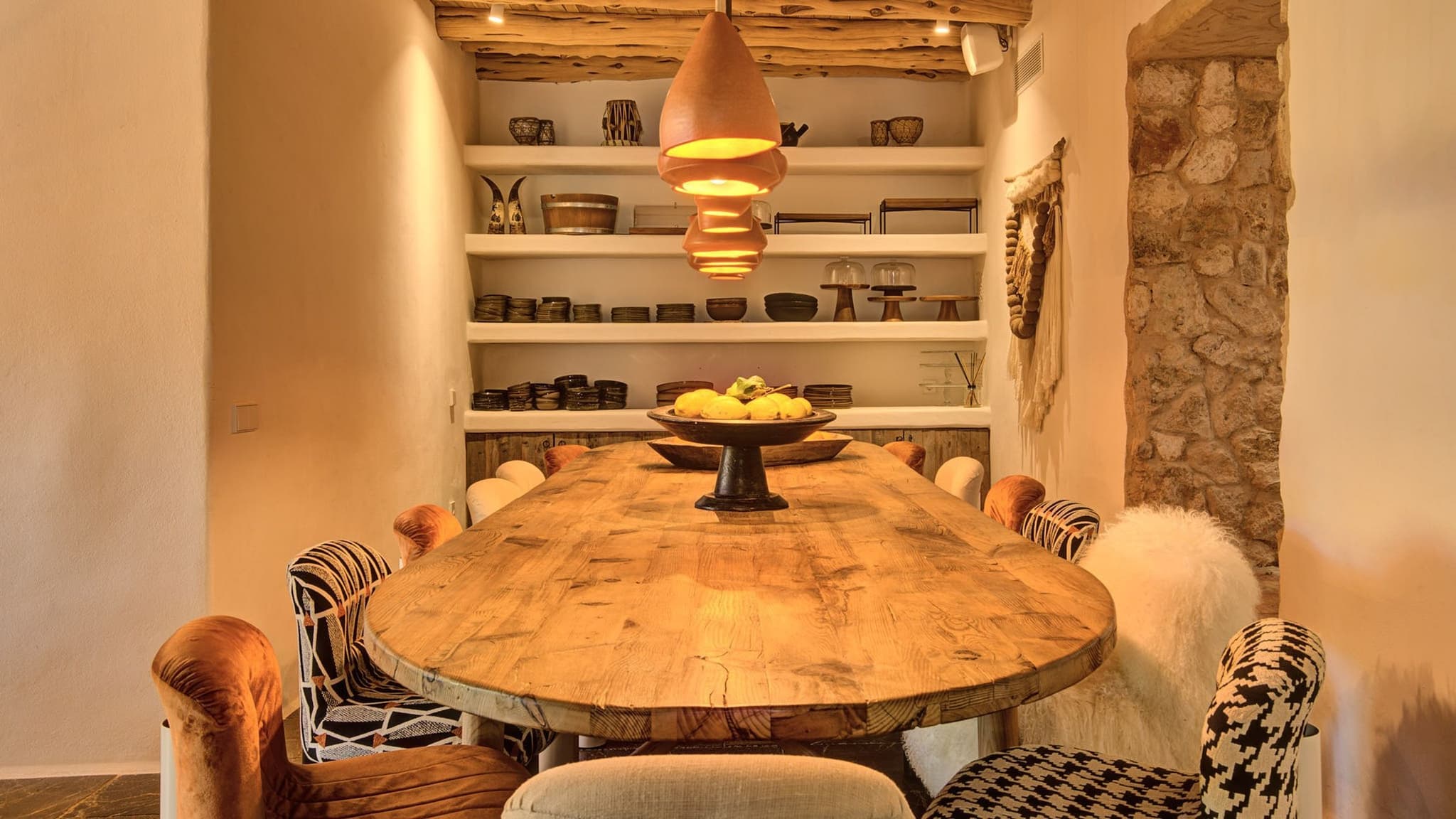 Oval wood dining table copper pendants villa clarence ibiza spain padel