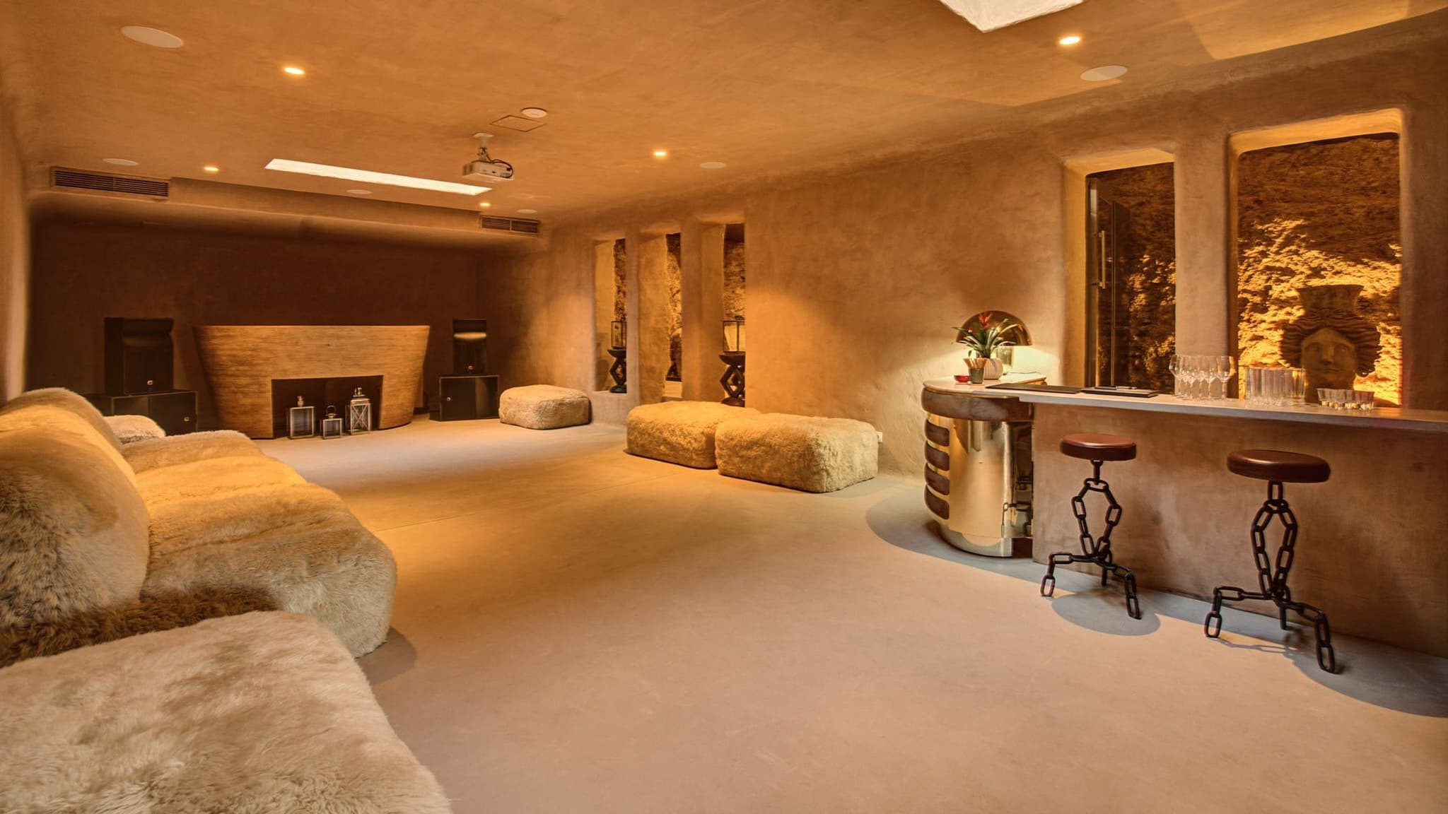 The plaster lounge, sheepskin seating by the bar