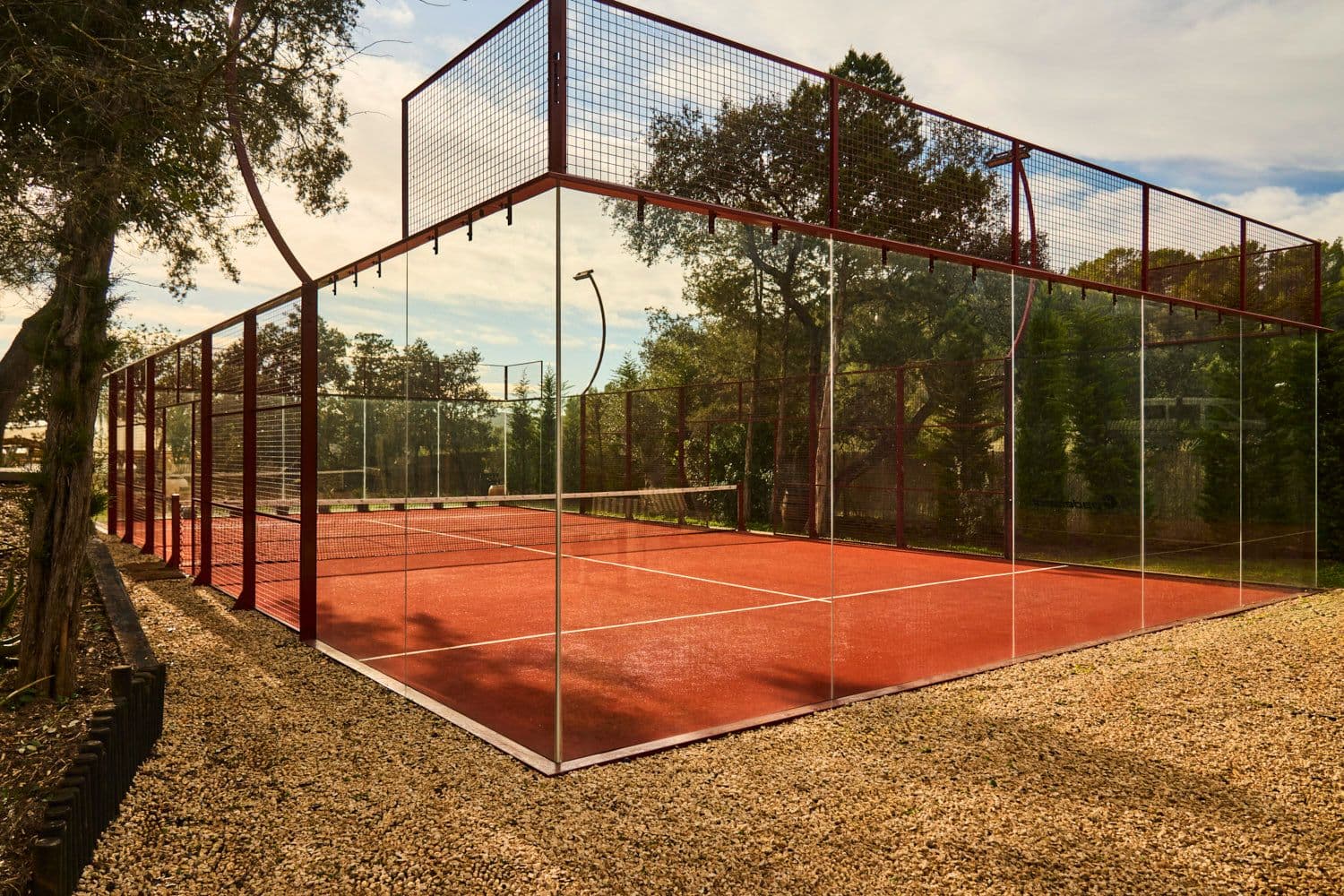 Private padel court red clay surface villa clarence ibiza spain