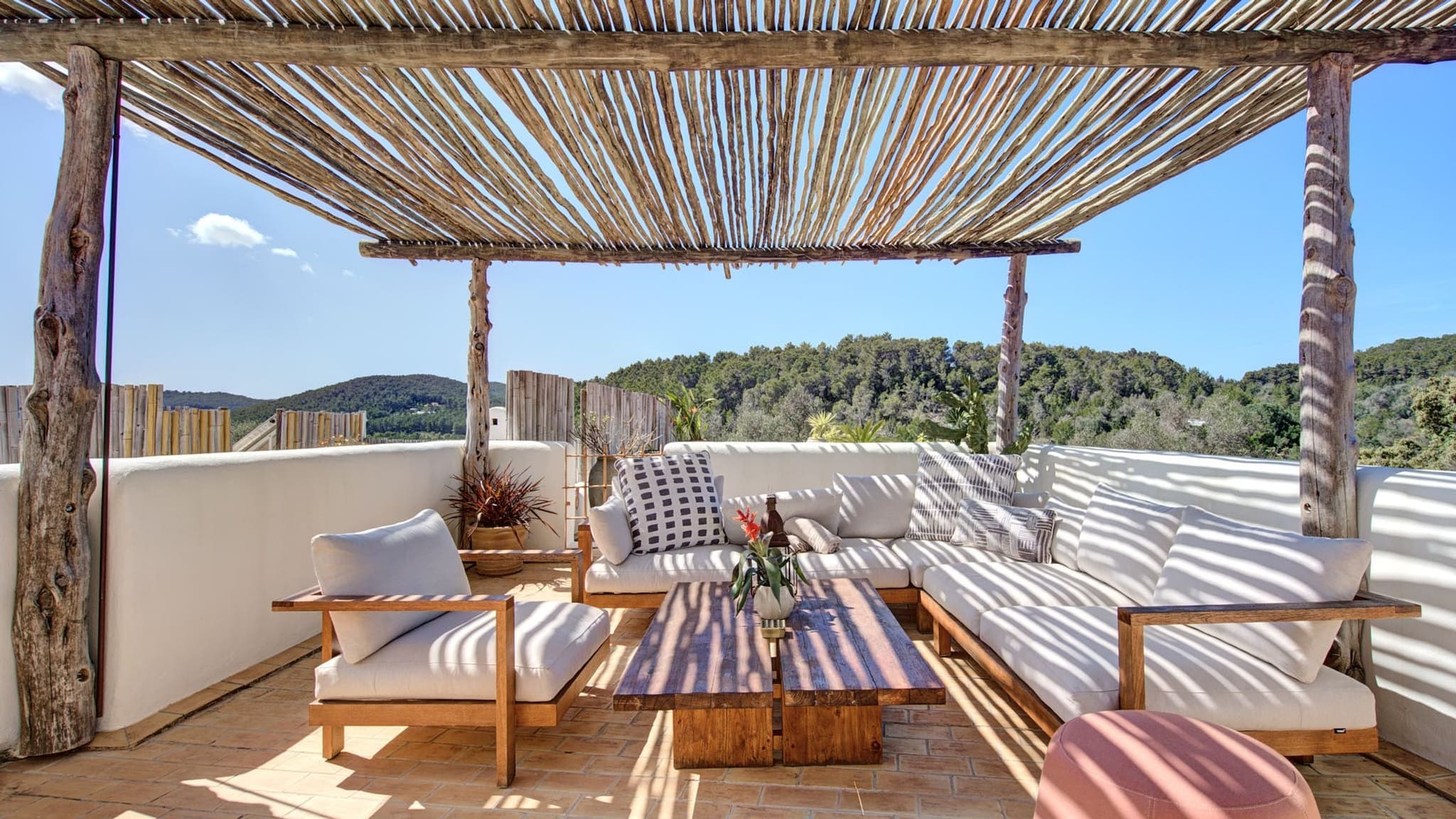 The rooftop terrace under its reed pergola