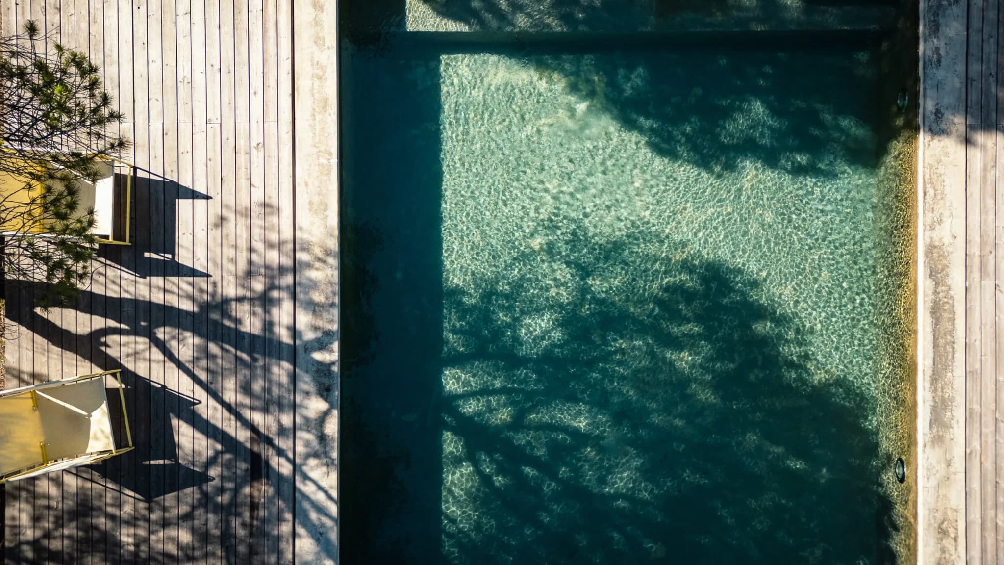 Aerial pool dappled shade deck villa lapa comporta portugal padel