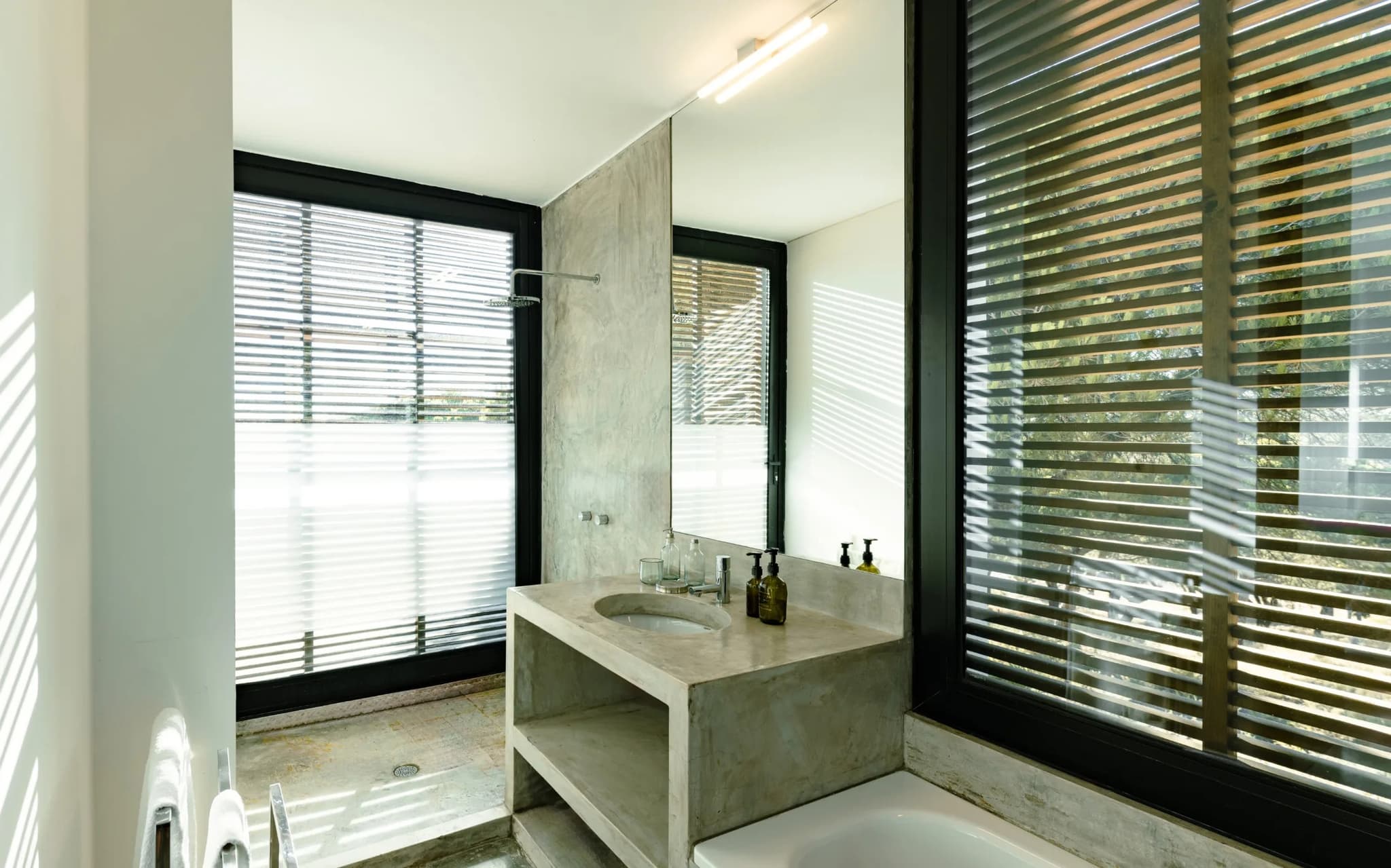 Concrete vanity bathtub venetian blinds villa lapa comporta portugal padel