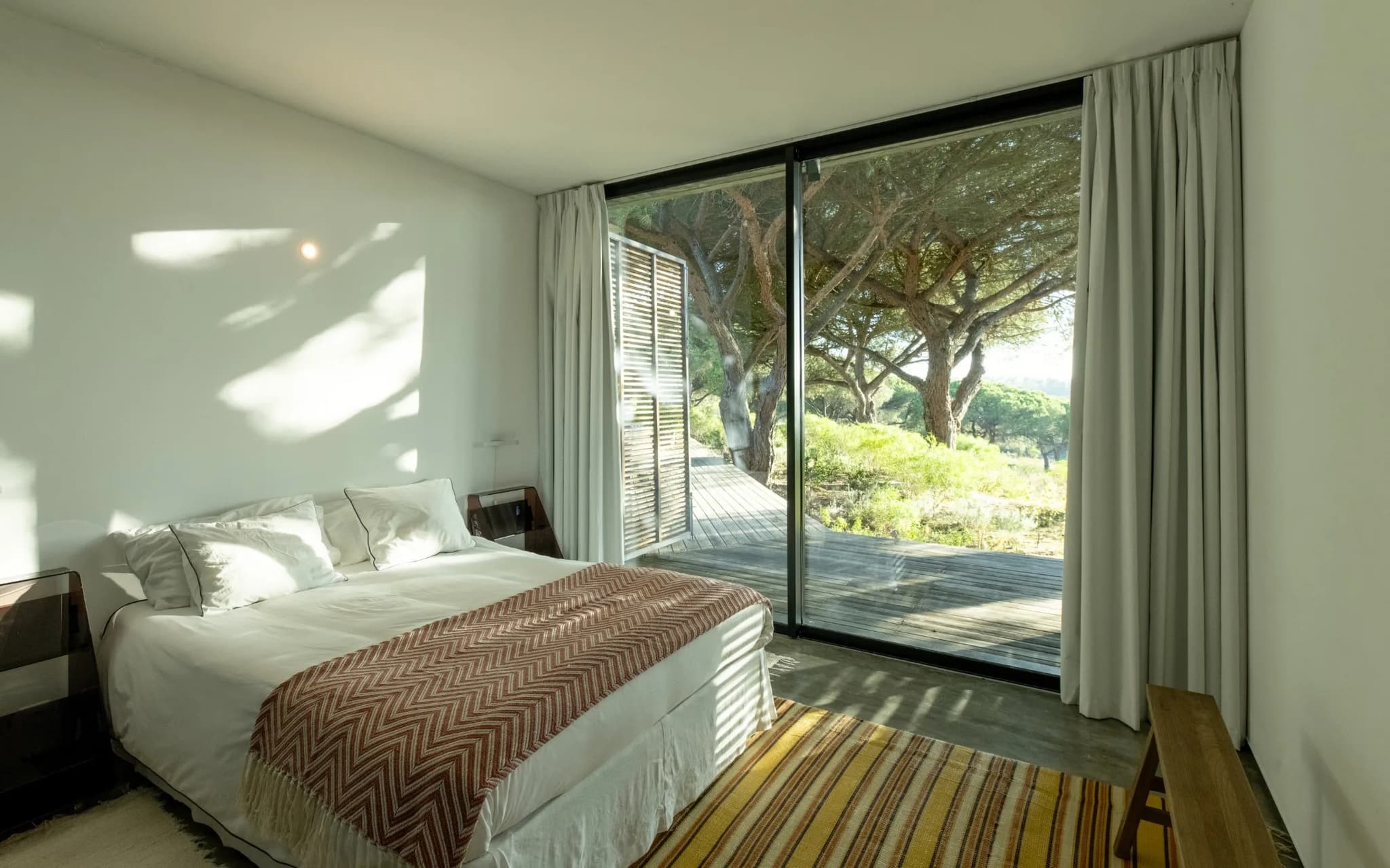 Double bed ochre throw deck view villa lapa comporta portugal padel