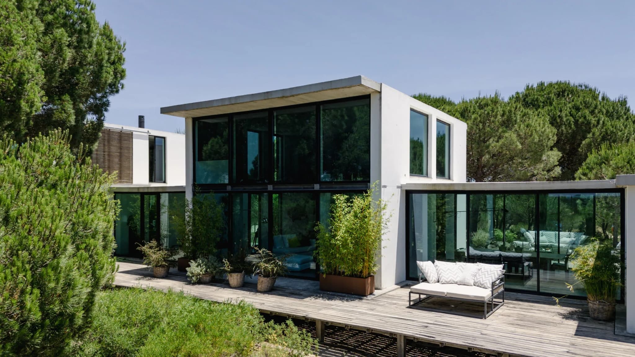 Glass facade terrace sofa pine villa lapa comporta portugal padel