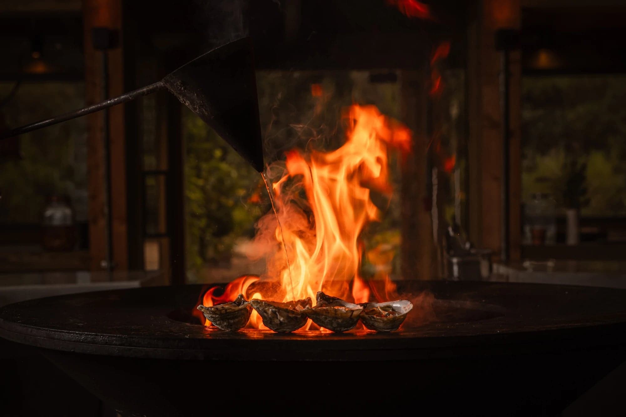 A chef cooking over the open fire